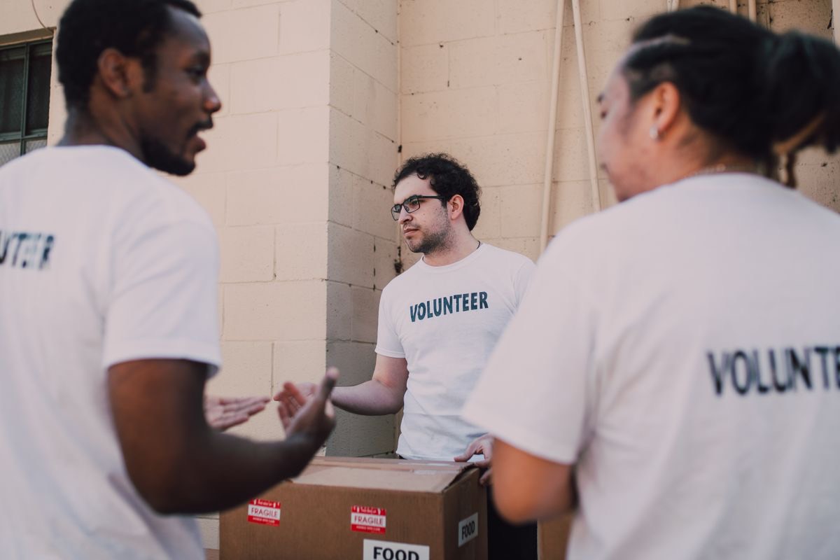 Sponsors and volunteers talking together at a charity event